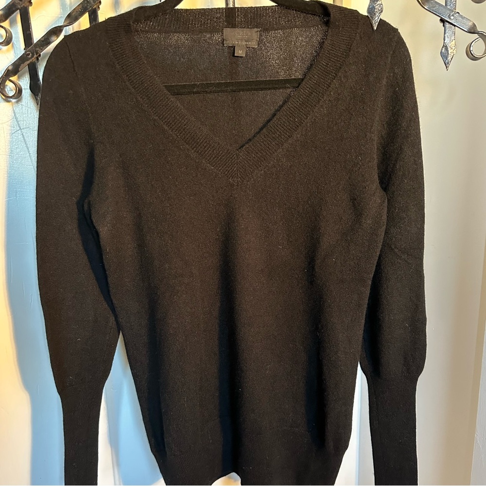 J. Crew black, thin, cashmere sweater. 
Tapered sleeves.